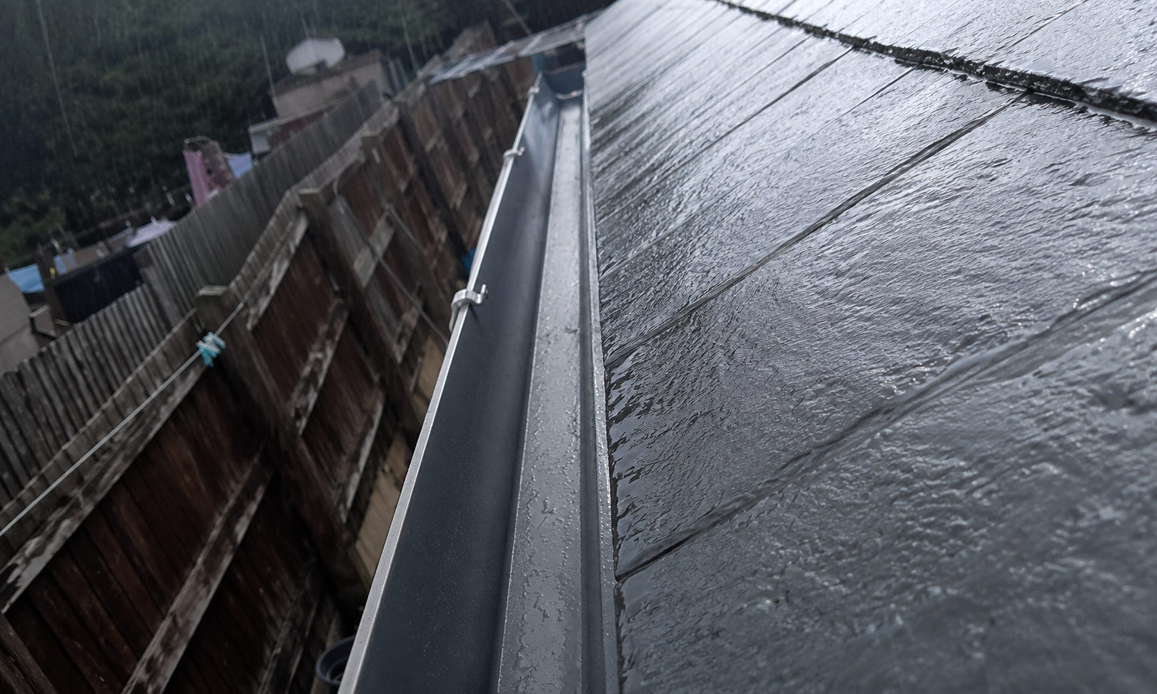 Birmingham gutter after summer inspection showing fully cleared channel with silt layer removed